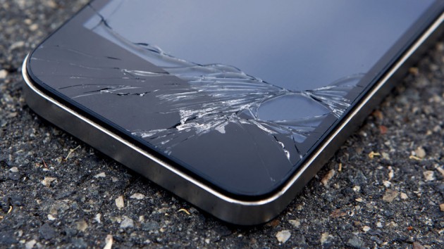 Detail of a smart phone with a cracked screen